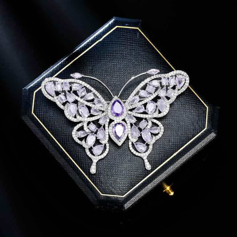 Purple butterfly brooch presented in a gift box