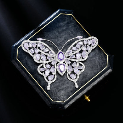 Purple butterfly brooch presented in a gift box