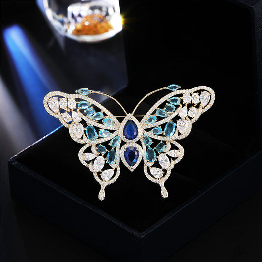 Blue zircon butterfly brooch with openwork filigree wings