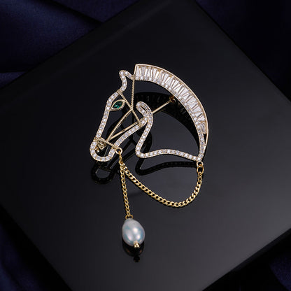 Gold horse head brooch with zircon stones and freshwater pearl drop