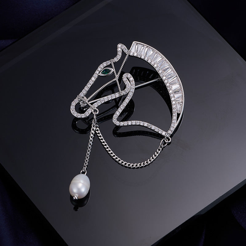 Silver horse head brooch with zircon stones and pearl drop