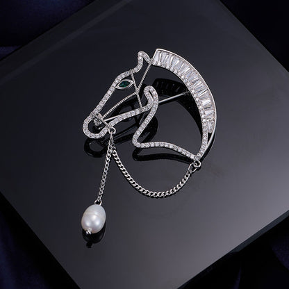 Silver horse head brooch with zircon stones and pearl drop