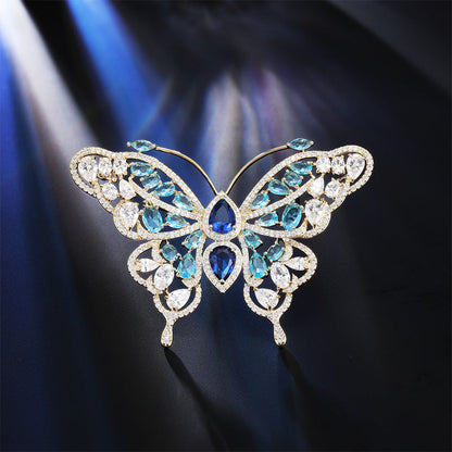 Blue zircon butterfly brooch catching the light