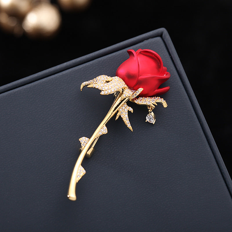 Red rose brooch with sparkling zircon leaves