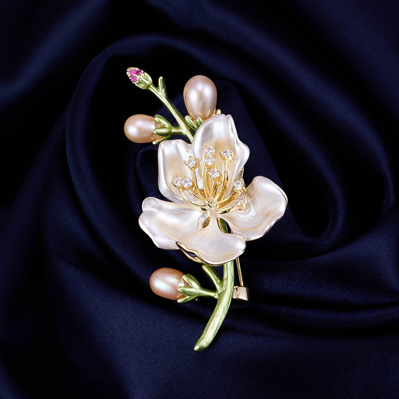 Magnolia brooch on navy silk