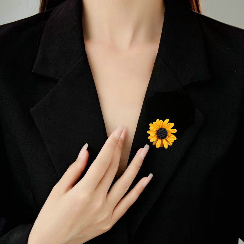 Sunflower brooch worn on a black blazer